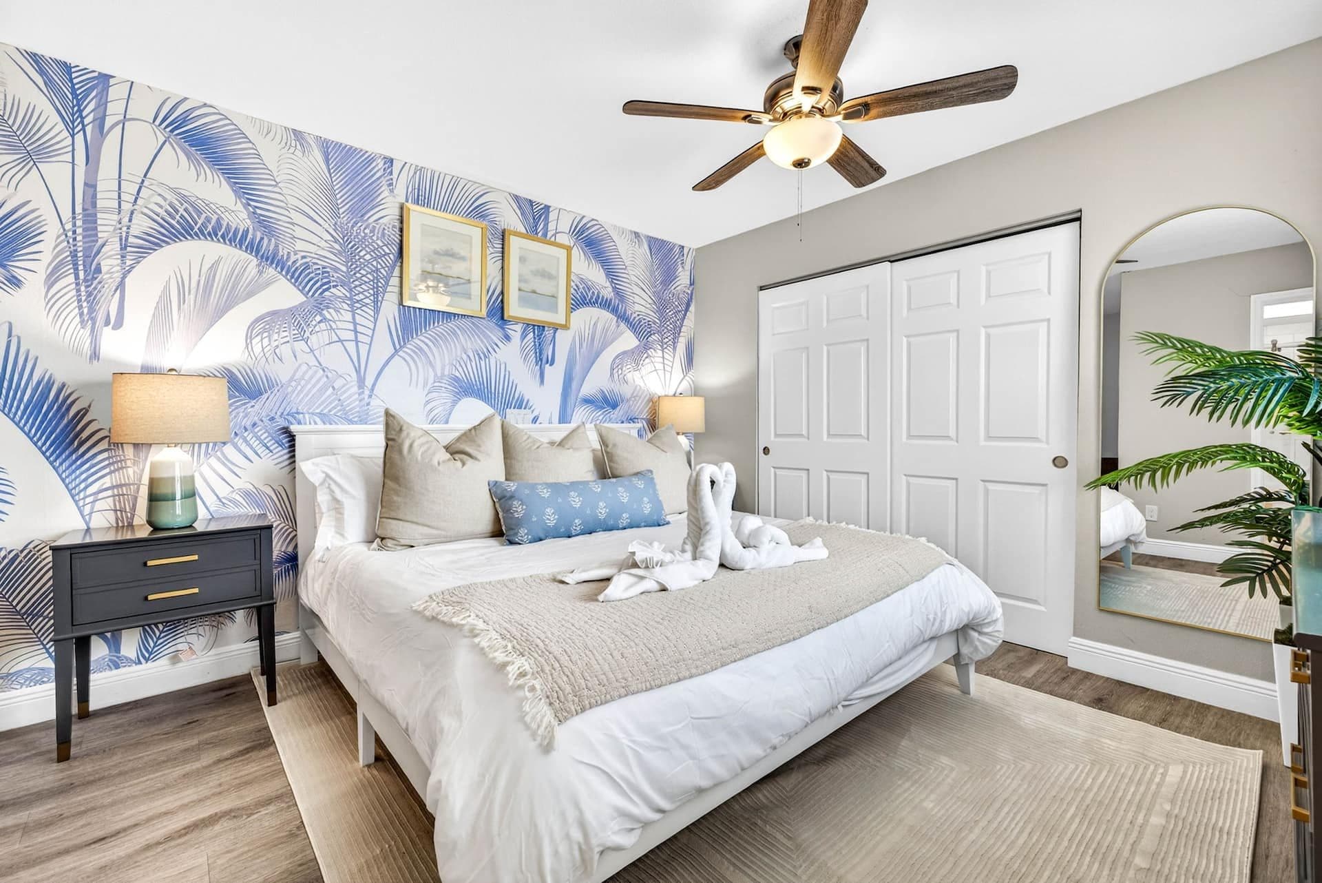 King bedroom with blue palm wallpaper at Coastal Breeze in Indian Rocks Beach, Florida