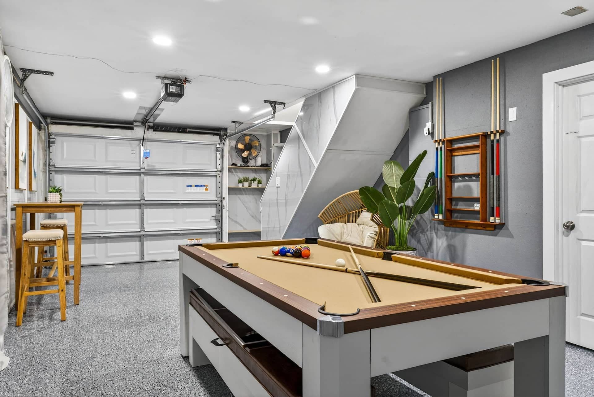 Garage game room with a pool table at Coastal Breeze in Indian Rocks Beach, Florida